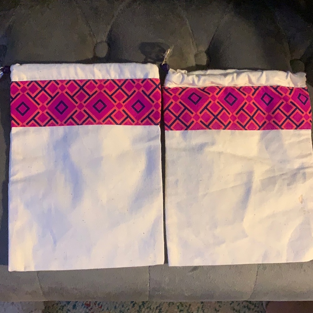Two shoe storage bags from Tory Burch.